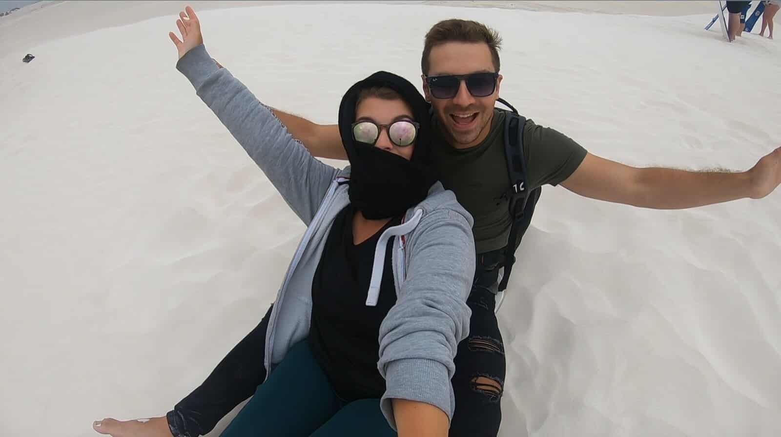 Couple Sandboarding at Lancelin Sand Dunes]